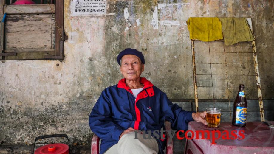 An old veteran in Hoi An. He has two beers...