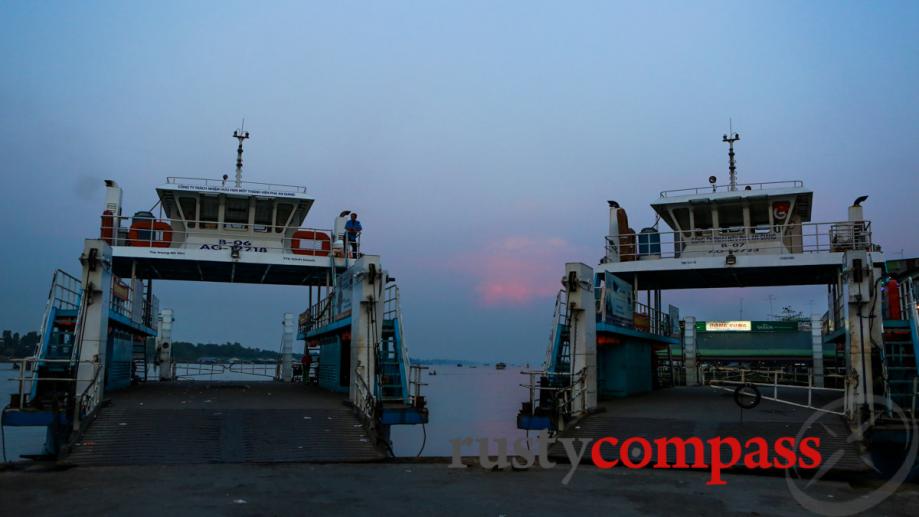 Sun goes down on Mekong River ferries.
