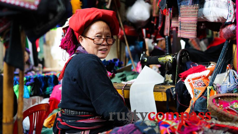 A Red Dzao woman  with beautiful handmade fabrics in...