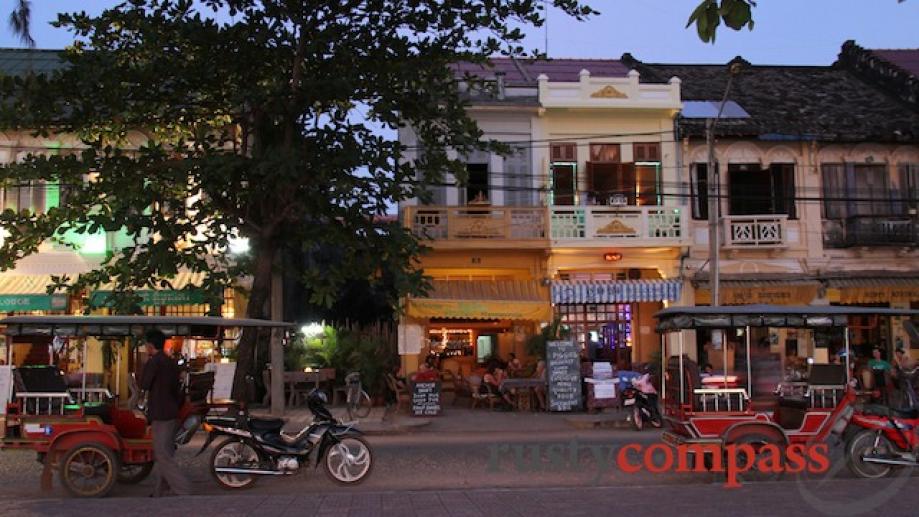 This small strip of bars on the Kampot waterfront comes...