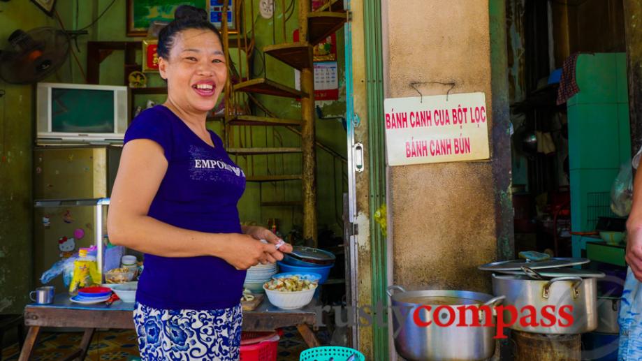 Street stalls sell local specialties like banh canh bun noodles.