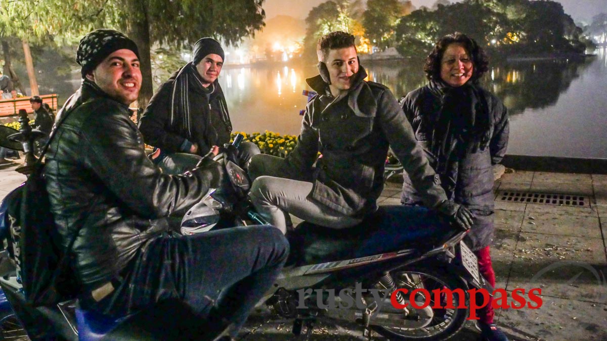 3 Palestinian students - fluent Vietnamese speakers, at Hoan Kiem Lake late at night.