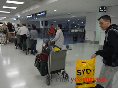 Travellers about to experience Saigon's taxi mayhem. airport,Ho Chi Minh City,Saigon,taxi,Vietnam