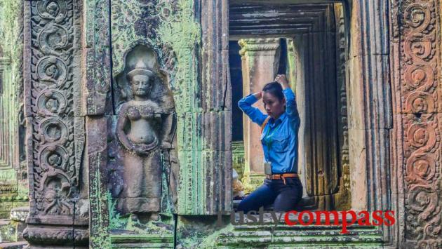 Angkor then and now - a temple attendant.