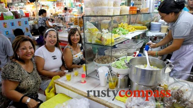 Three American Vietnamese ladies look forward to dessert.