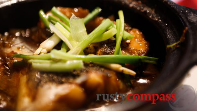 Ba Sa fish, a Chau Doc specialty, stewed in a bowl and served at Mekong Restaurant, Chau Doc.