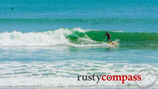 Catching a wave on My Khe beach, Danang