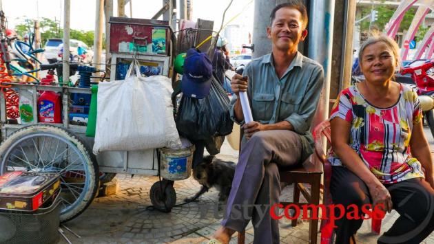 Love on the streets - husband and wife team fixing motorbikes and serving drinks on the streets.