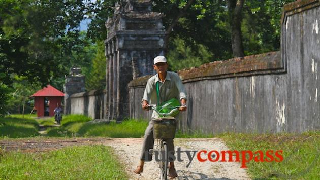 Local rides along the outer wall of Minh Mang's Tomb