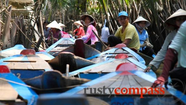 Canal boats line up to meet the tourists. My Tho