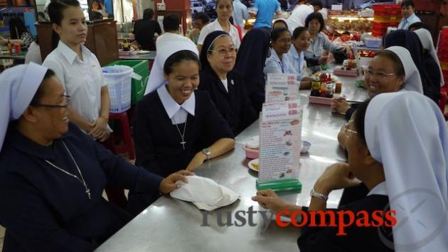 A group of Thai nuns check in for dinner at Nhu Lan