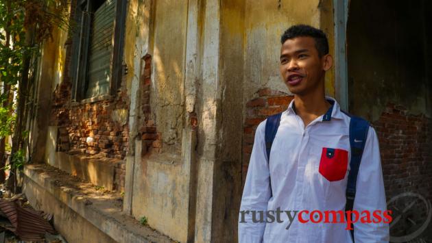 Our Khmer Architecture tour guide, Virak, in the crumbling former police headquarters, Phnom Penh