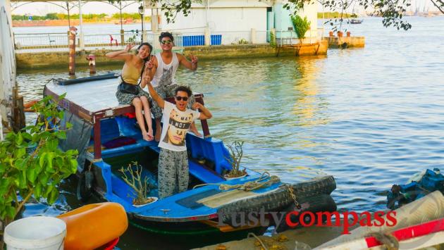 Happy travellers disembark from a boat ride on the river.