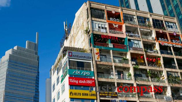 Explore Saigon's unique old apartment buildings and their cafes.