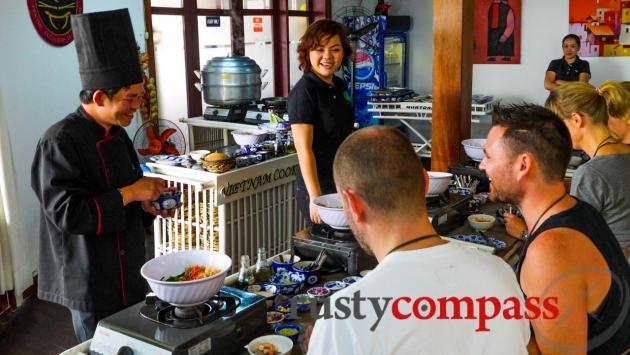 Travelllers taking a cooking class in Saigon.