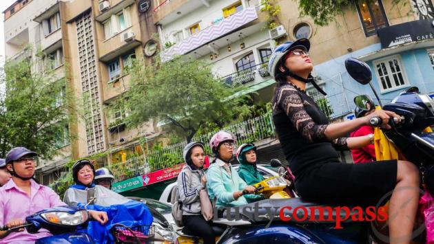 Motorbikes and a deco apartment block - Saigon