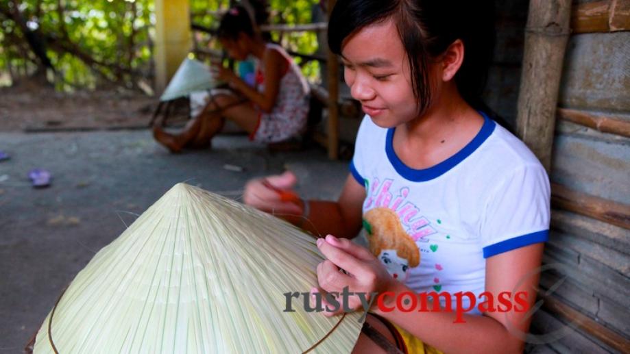 Making conical hats at a small village outside Hue.