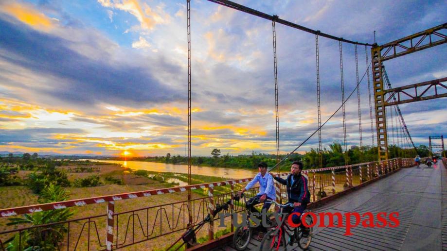 Bridge over the Dakbla River in Kontum at sunset.