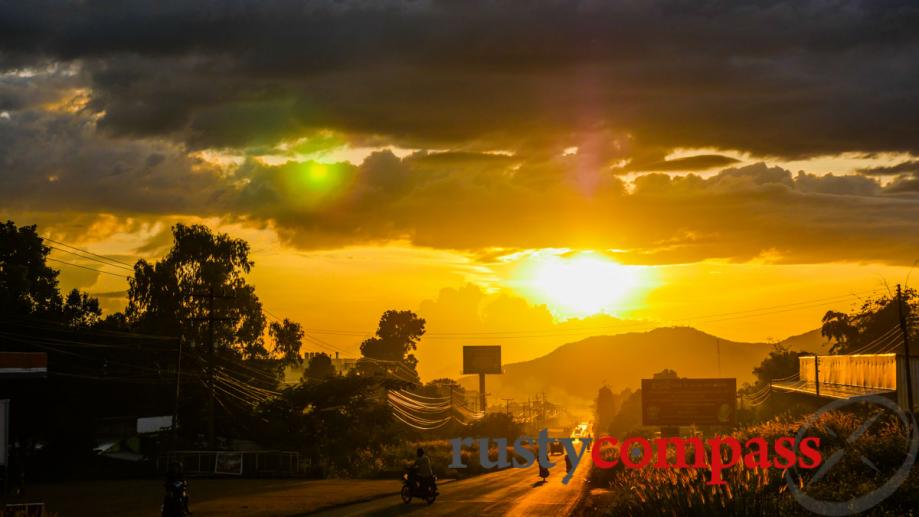 The sun sets on the road back to Pakse.