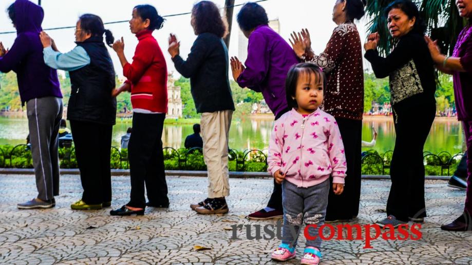 Generation gap. Hoan Kiem Lake, Hanoi