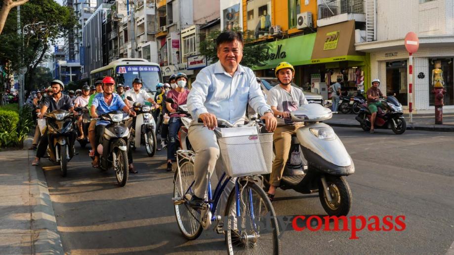 The lonely cyclist, Saigon. Two decades ago, these streets were...