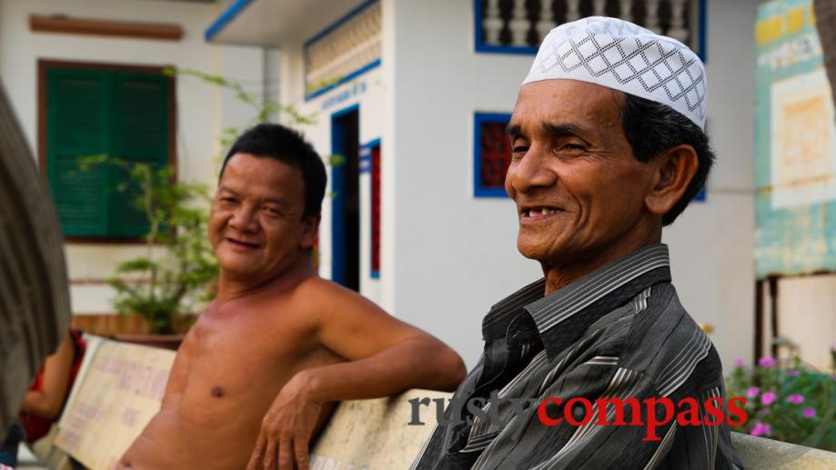 Cham men in the Mubarak Mosque, Chau Giang, Chau Doc.