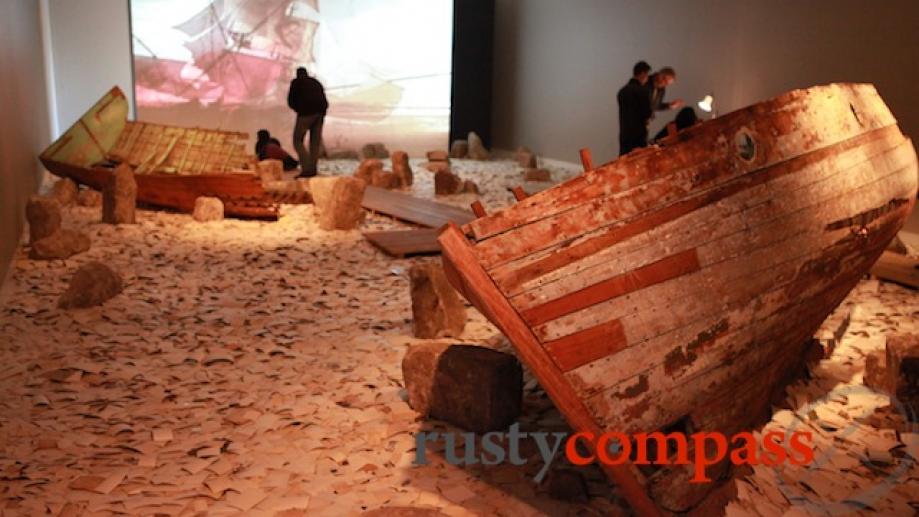 Wrecked boats lie on thousands of family photos. The Erasure...