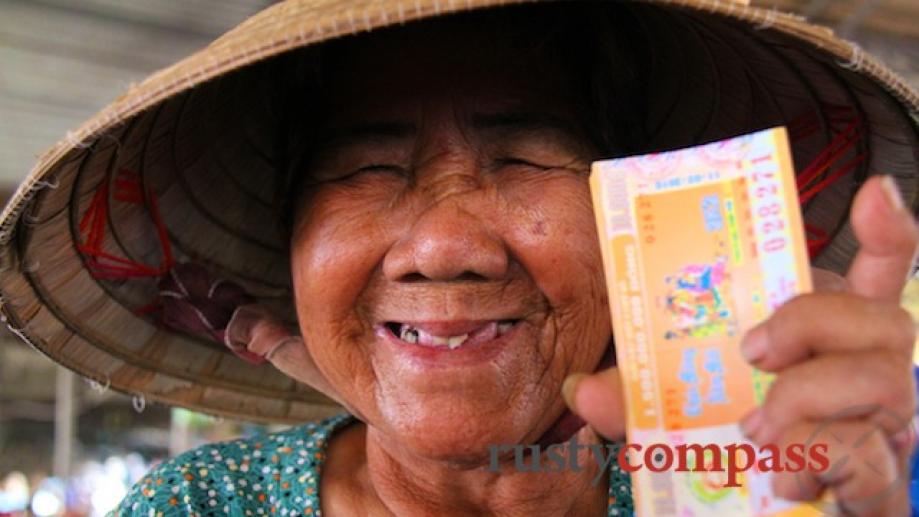 Lottery ticket seller, 82, at Ha Tien market