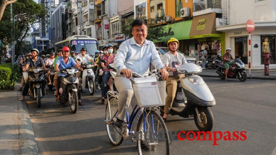 The lonely cyclist, Saigon. Two decades ago, these streets were...