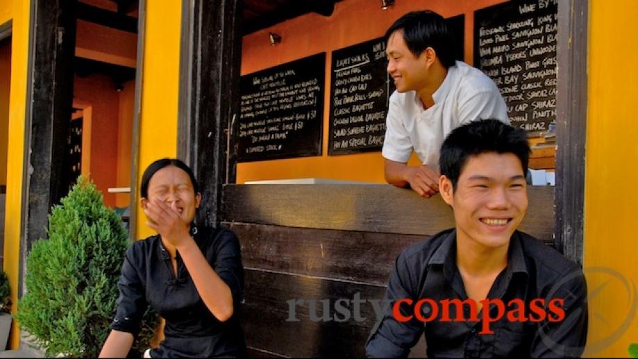 Staff at White Marble wine bar having a chuckle.