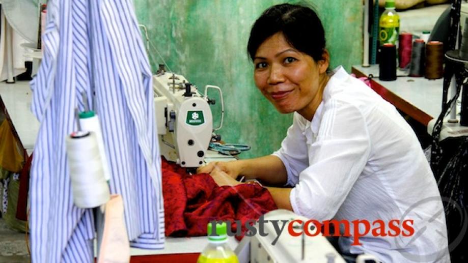 Churning out those much loved clothes for tourists. Hoi An's...