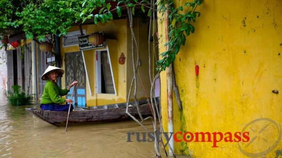 Navigating Hoi An's flooded streets.