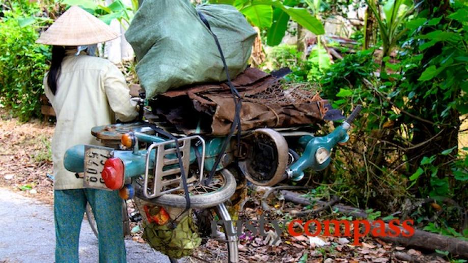 Cycling in the Hue countryside. A heavy load - this...