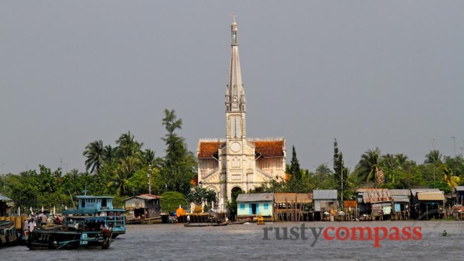 Cai Be floating market and its distinctive cathedral.