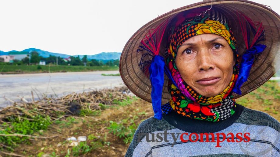 Local minority woman takes a break from planting cassava for...