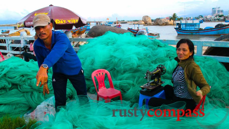Nha Trang waterfront. Repairing fishing nets.
