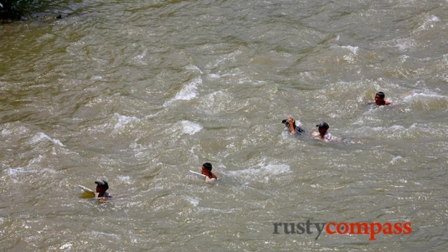 Kids play in the river in Old Lai Chau town.