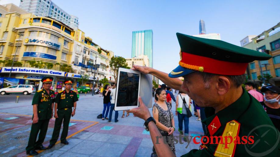 On 30 April, military brass use an iPad to catch...