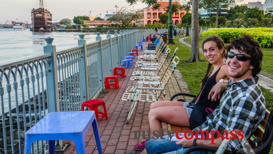 Tourists cooling off by the Saigon River