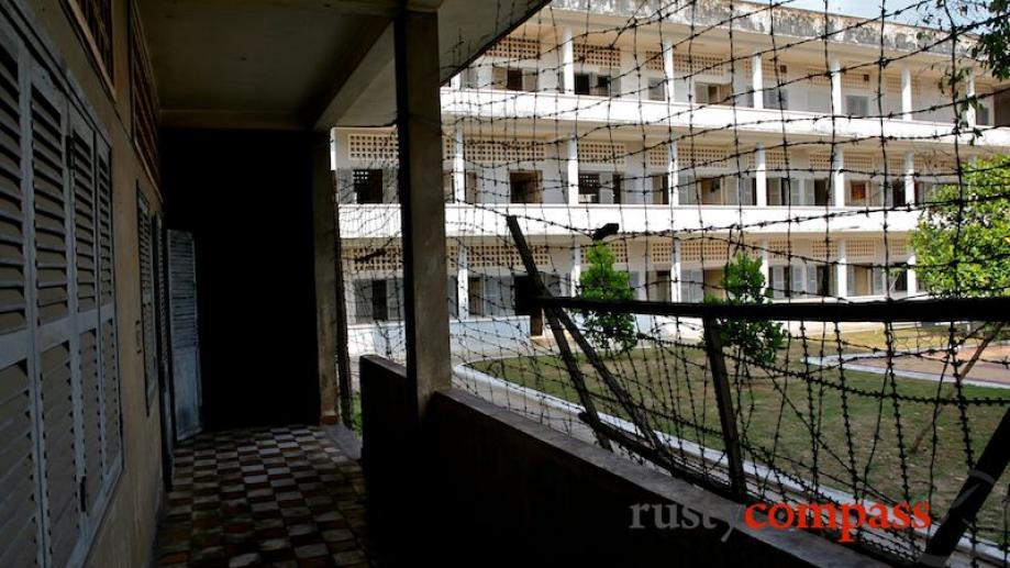 Barbed wire encloses the former classrooms.