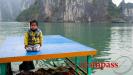 Slice of life Vietnam - Halong Bay fruit boat with little guy on top